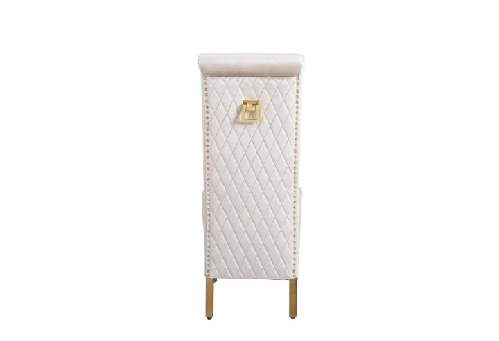 A beige upholstered dining chair with a gold-colored metal frame and a square knocker on the backrest.