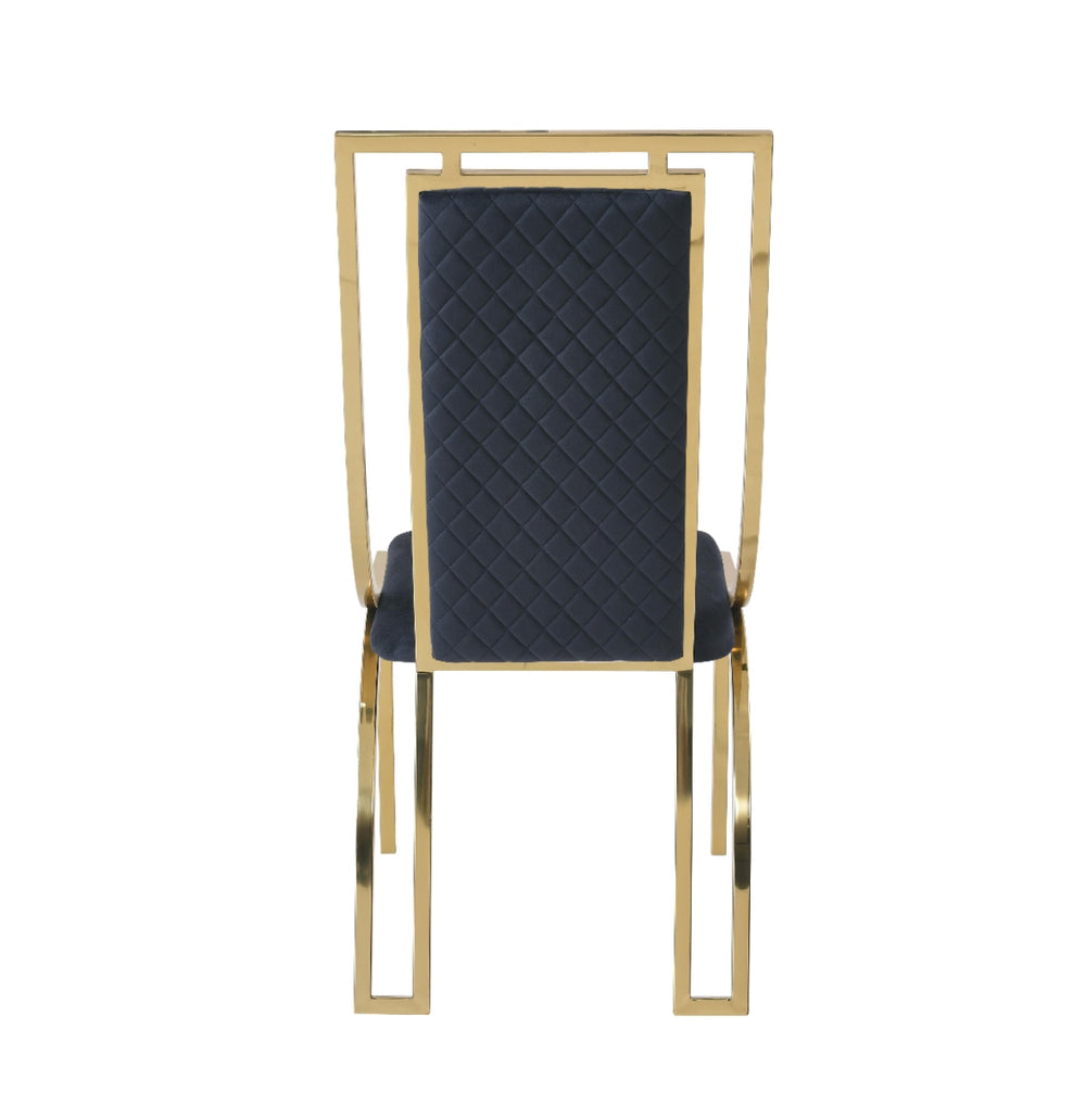single  modern high back dining chairs with quilted cream upholstery and gold stainless steel frame, shown on light wood flooring against textured wallpaper