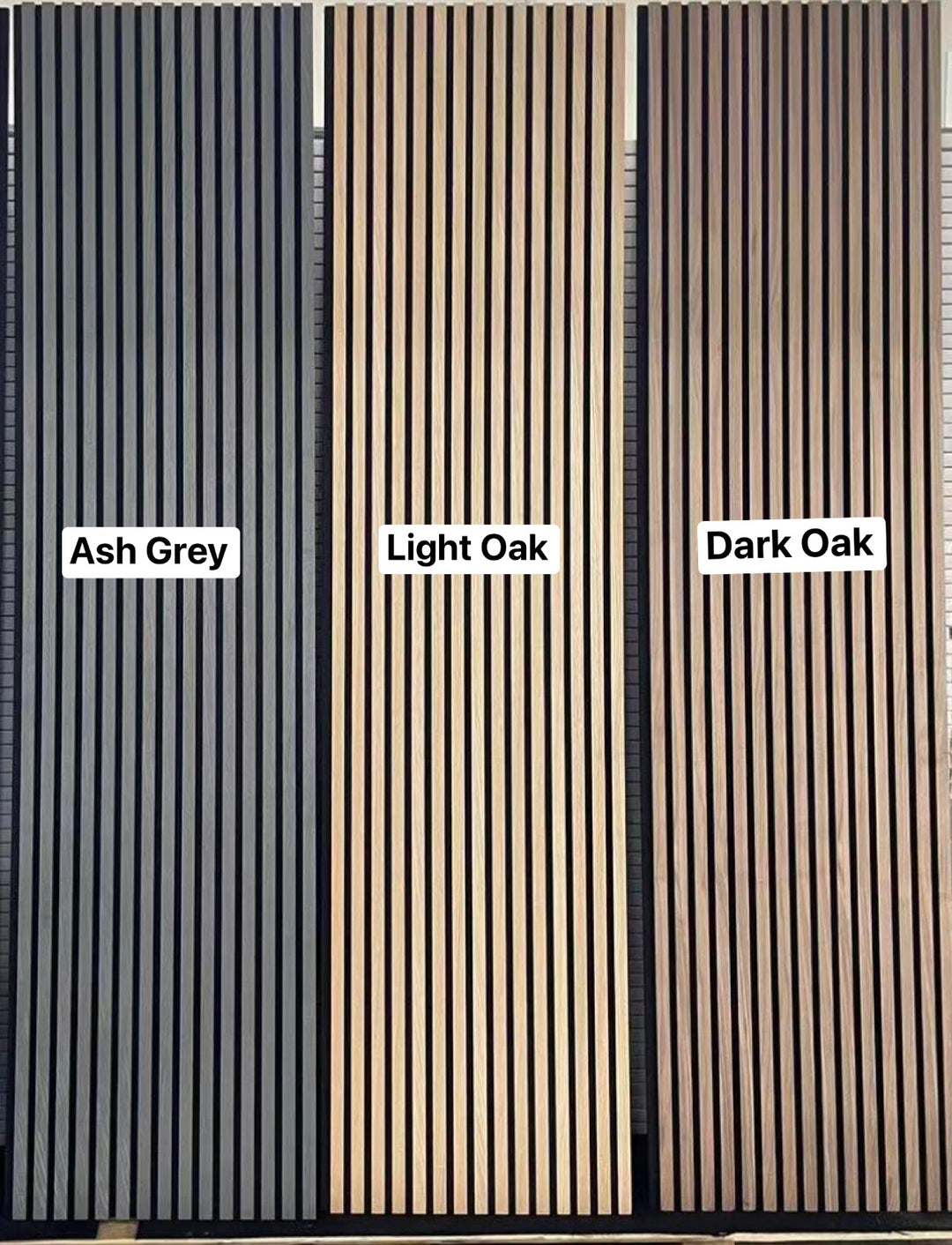 A room with light oak wood effect veneer wall panels and a flat-screen television mounted on the wall, alongside a tall indoor plant.