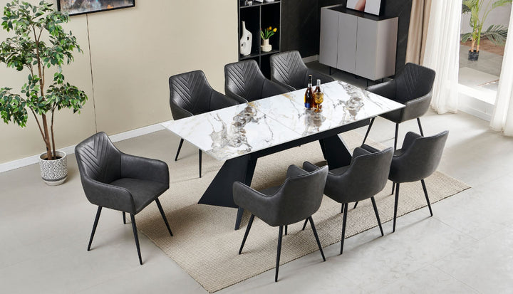 Contemporary dining set with white marble table and eight black faux leather chairs featuring angled legs in a modern dining room
