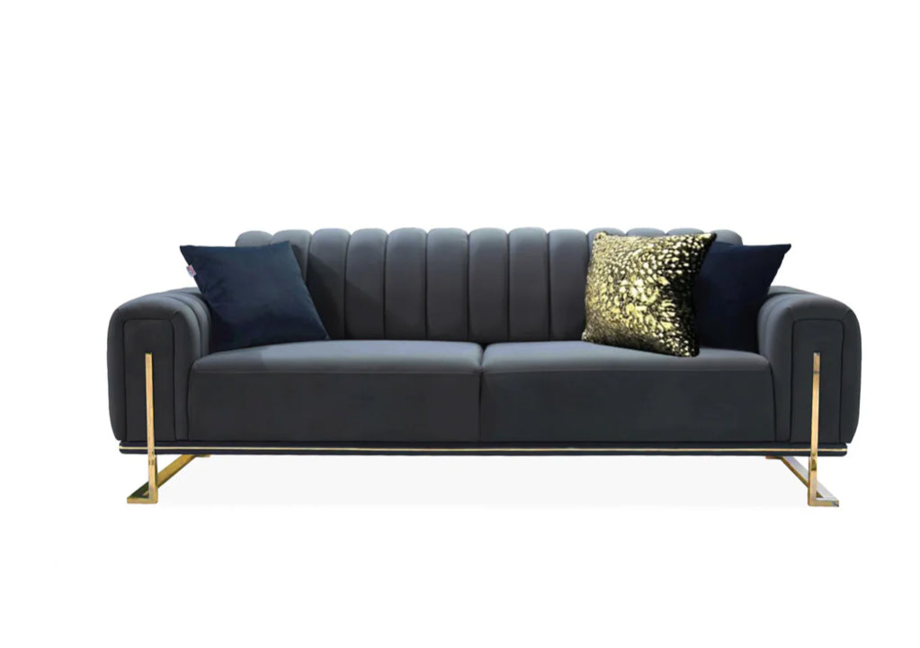 A black and gold Milan 3+2 sofa set with plush cushions, the sofa has a sleek design with channel tufting and gold-colored metal legs.