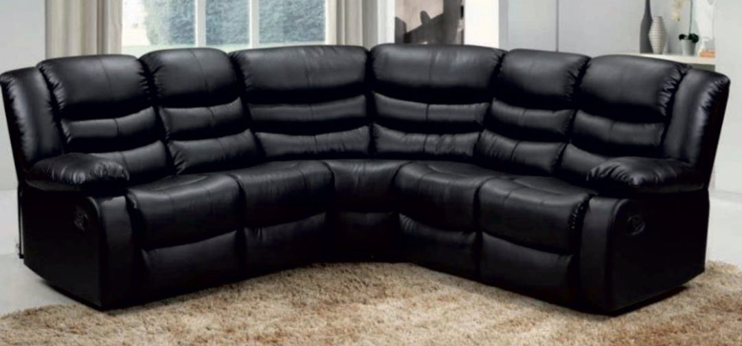 A black faux leather corner sofa with manual recliners on both ends, displayed in a living room setting.