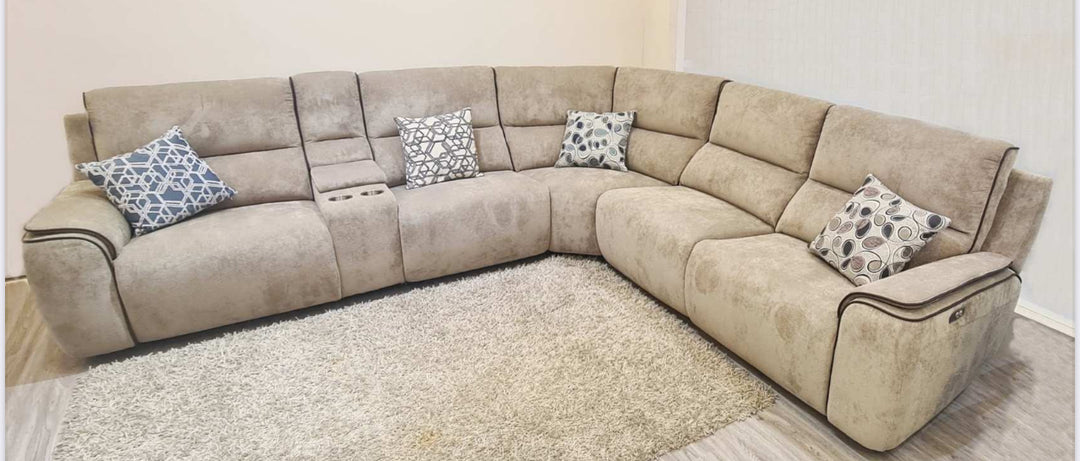 A beige corner sofa with power recliners, manufactured with softfeel weave fabric, positioned in a room on a carpet.