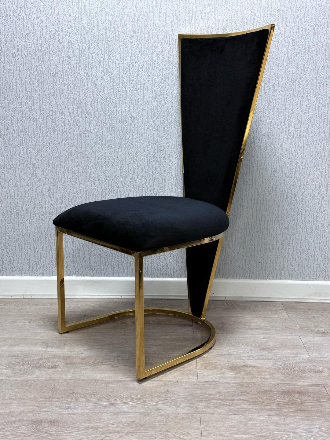 balck dining chair with gold leg and frame