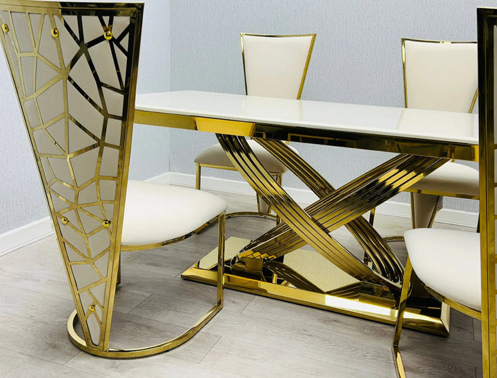 A Vienna cream and gold dining table and chair with a upholstered seat and a geometric patterned backrest in gold tone.