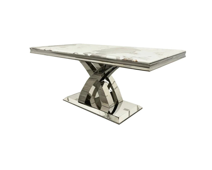 a white marble coffee table with chrome leg