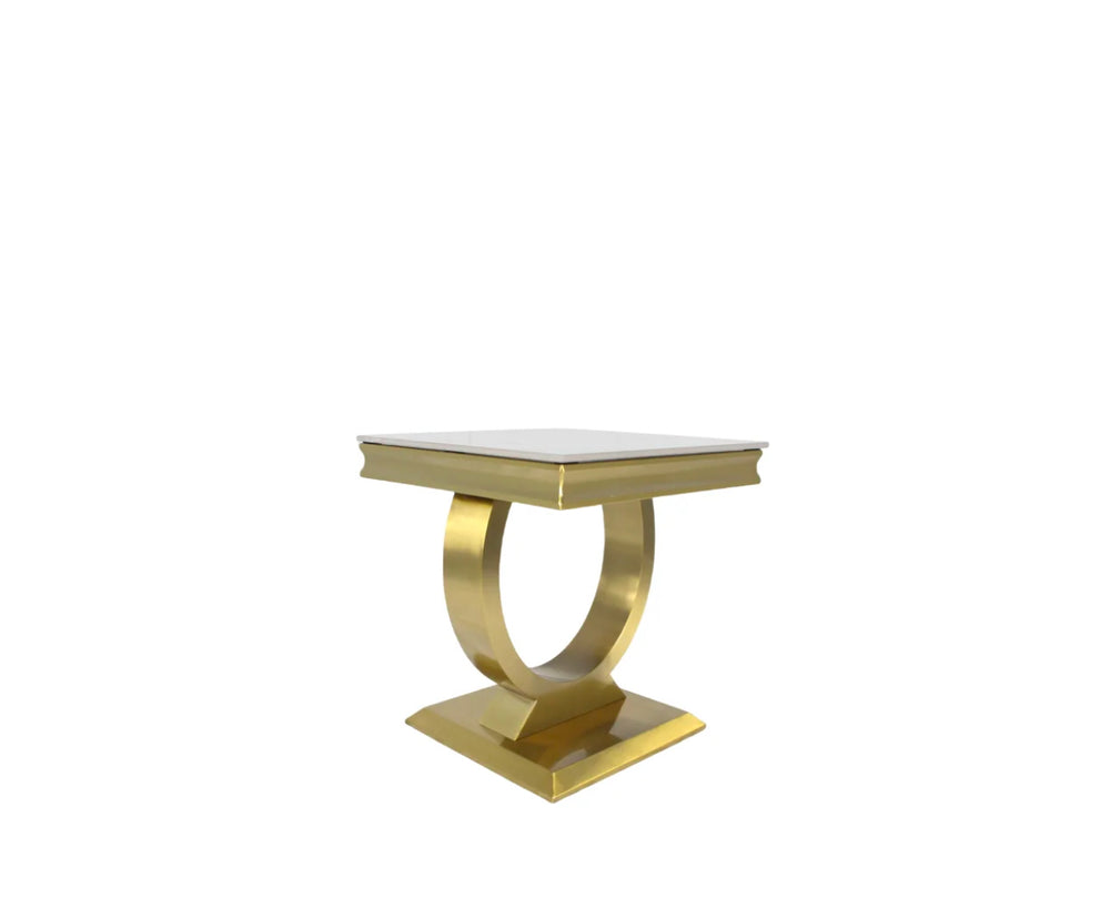 A gold-colored metal side table with a white marble top, featuring a geometric design with a circular base and a rectangular tabletop.