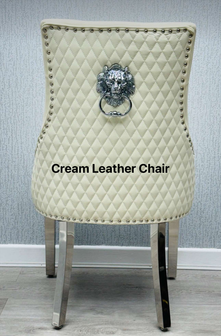 A beige upholstered dining chair with a light grey lion knocker on the backrest and chrome-colored legs.