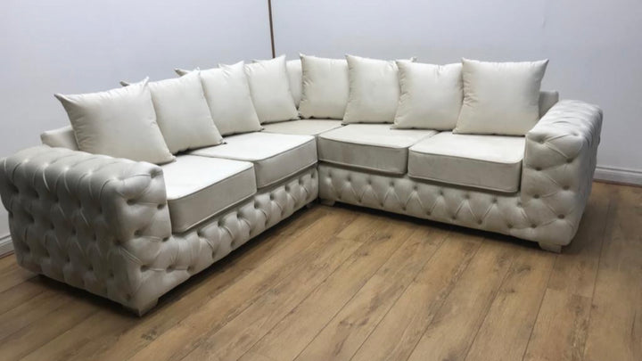 4 seater cream color sofa with sofa cushion
