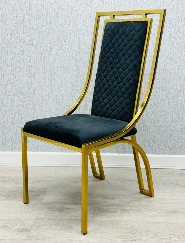 single  modern high back dining chairs with quilted cream upholstery and gold stainless steel frame, shown on light wood flooring against textured wallpaper