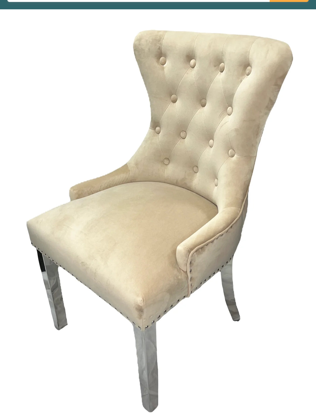 cream sit and gold leg dining chair font view in a elite ambient interiors showroom