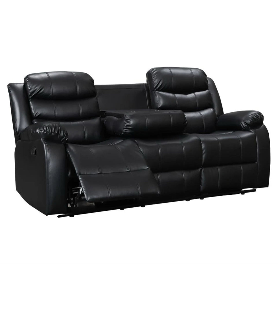 A black leather recliner sofa set, consisting of a 2-seater sofa, with drink holders, displayed in a room with grey flooring and skylights.