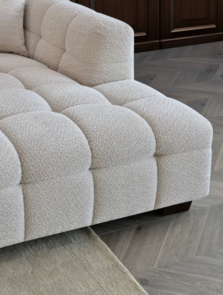 Beige textured sofa on a wooden floor