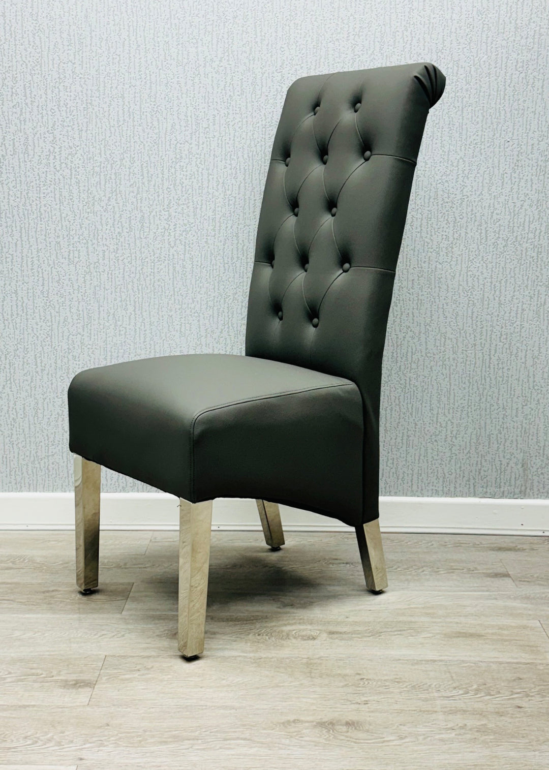 a luxury long chair black color with wooden leg