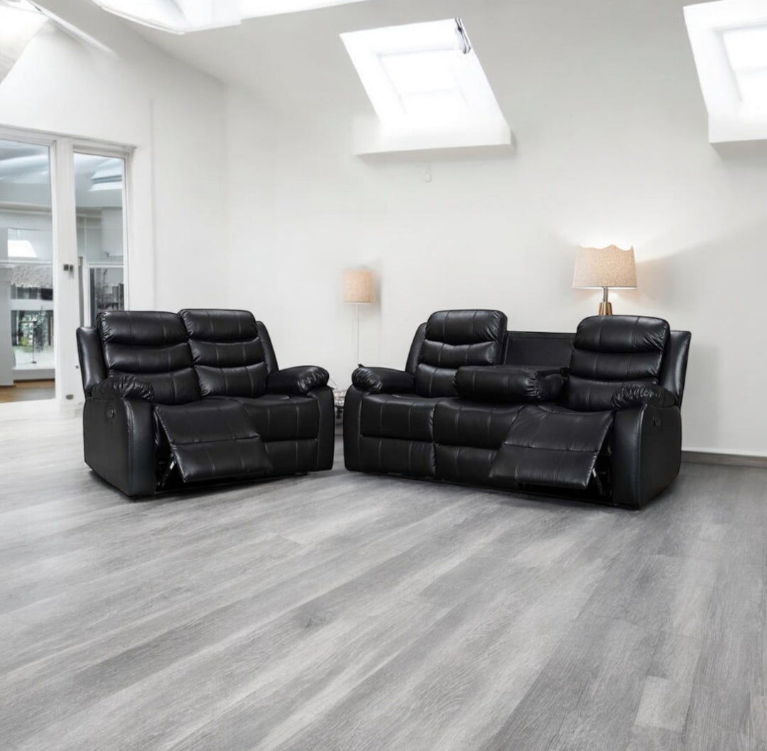 A black leather recliner sofa set, consisting of a 3-seater and a 2-seater sofa, with drink holders, displayed in a room with grey flooring and skylights.