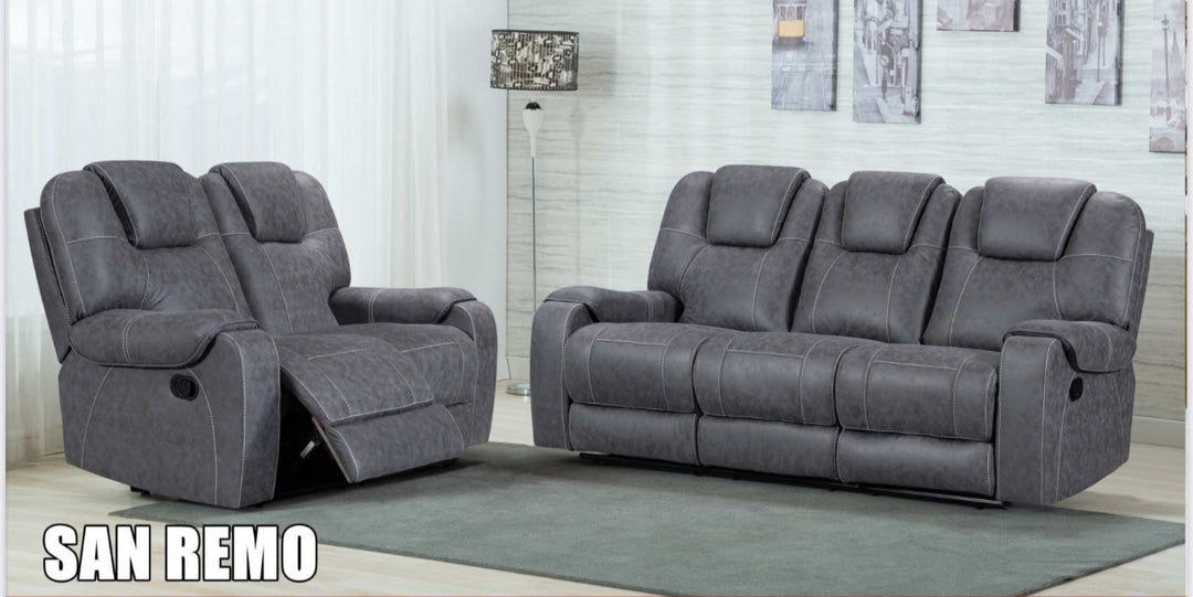 A set of gray San Remo recliner sofas, including a 1-seater, 2-seater, and 3-seater, arranged in a living room setting.