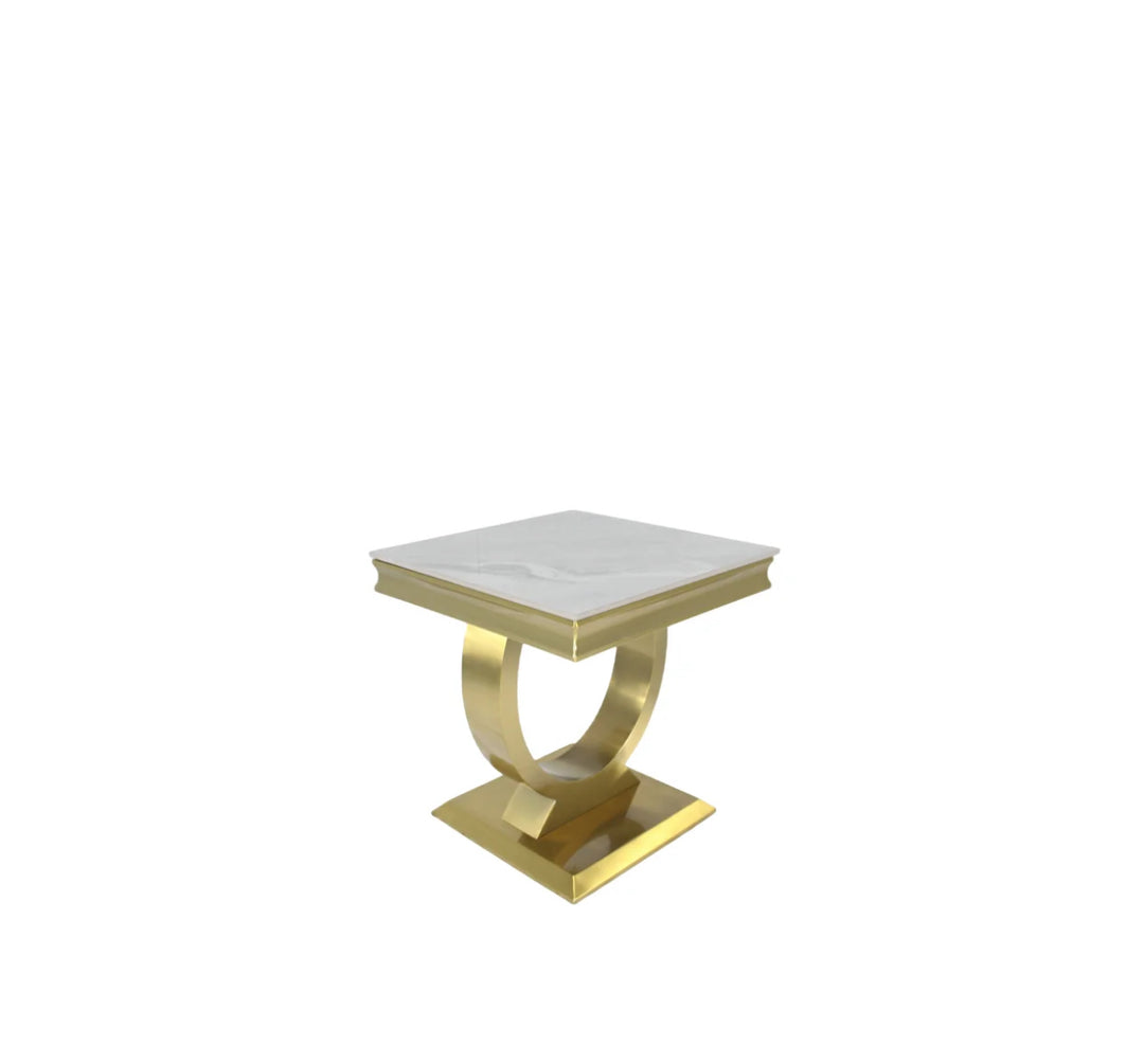 A gold-colored metal side table with a white marble top, featuring a geometric design with a circular base and a rectangular tabletop.