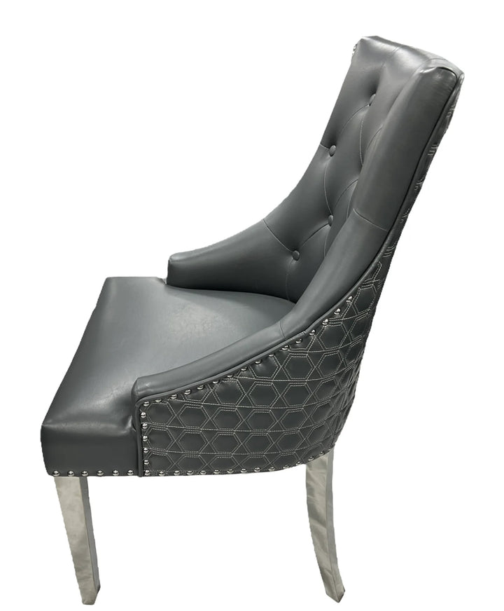 a luxury dining chair with black color sit and silver color leg