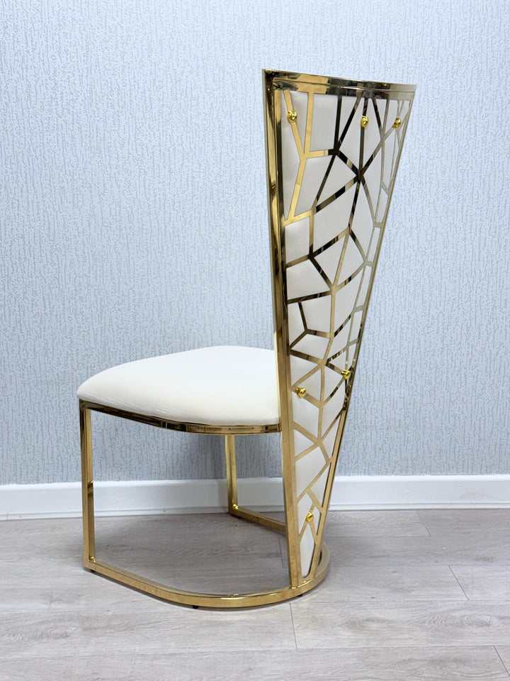A Vienna cream and gold dining chair with a upholstered seat and a geometric patterned backrest in gold tone.