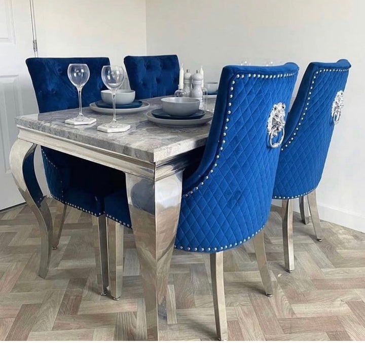 blue color dining chair and grey color marble color dining top with chrome color leg