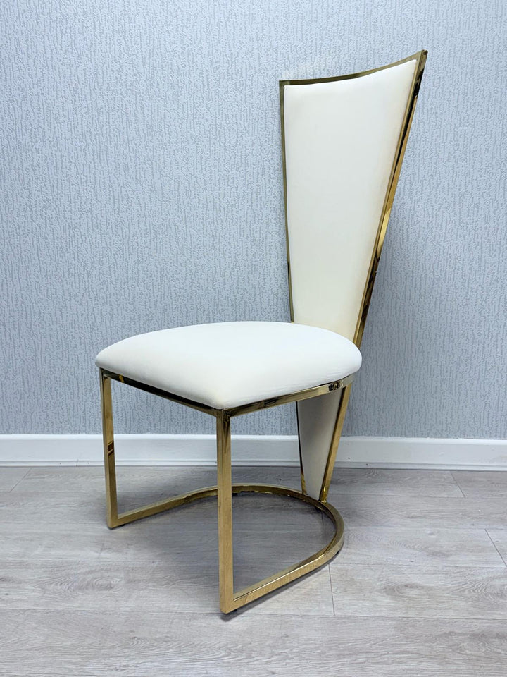 A Vienna cream and gold dining chair with a upholstered seat and a geometric patterned backrest in gold tone.