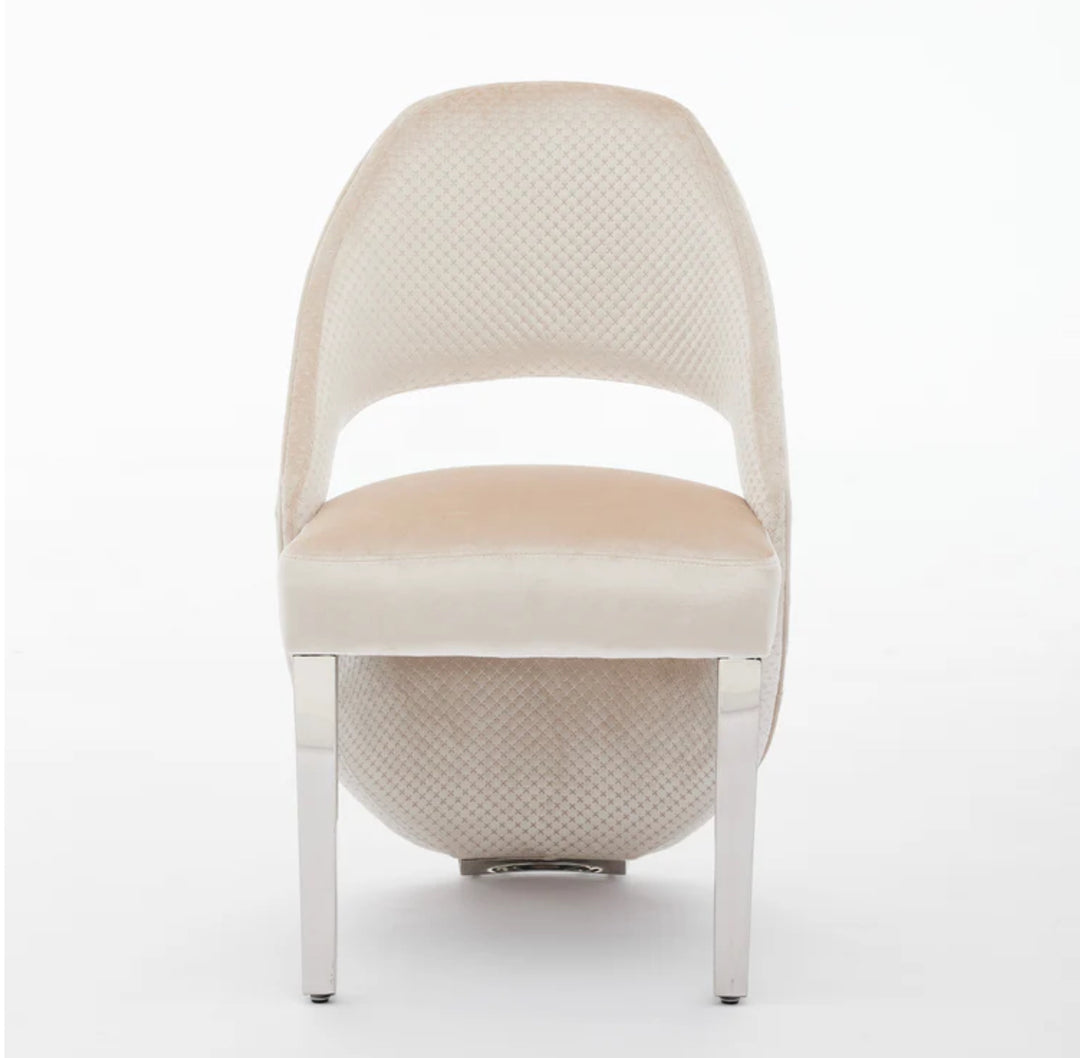 a luxury cream dining chair with silver leg font design