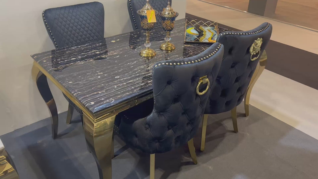 balck and gold marble table and chair in a dining room