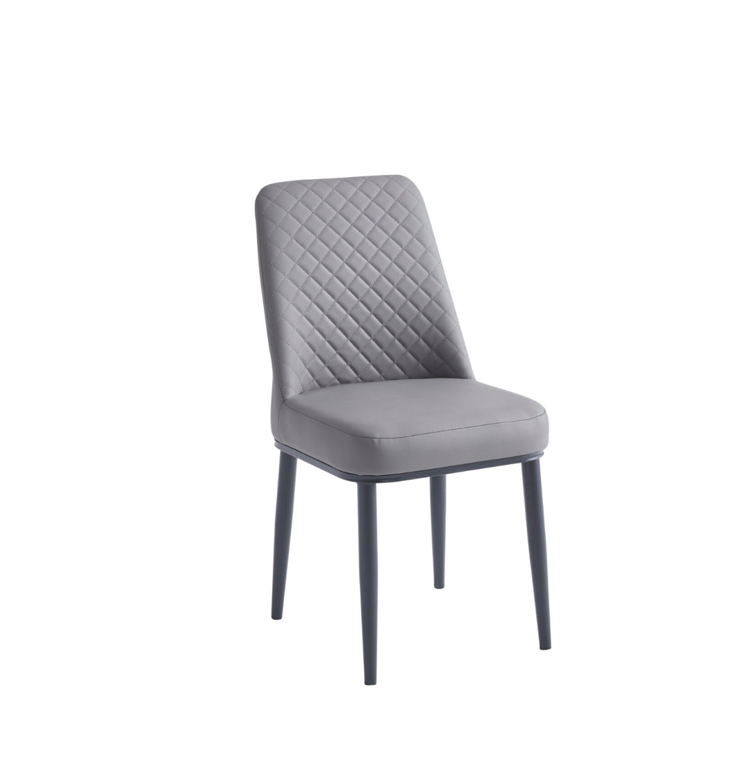 Gray upholstered chair with quilted backrest on a white background
