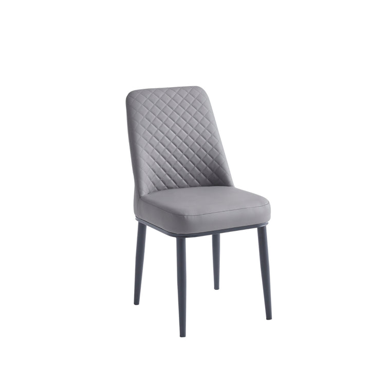 Gray upholstered chair with quilted backrest on a white background