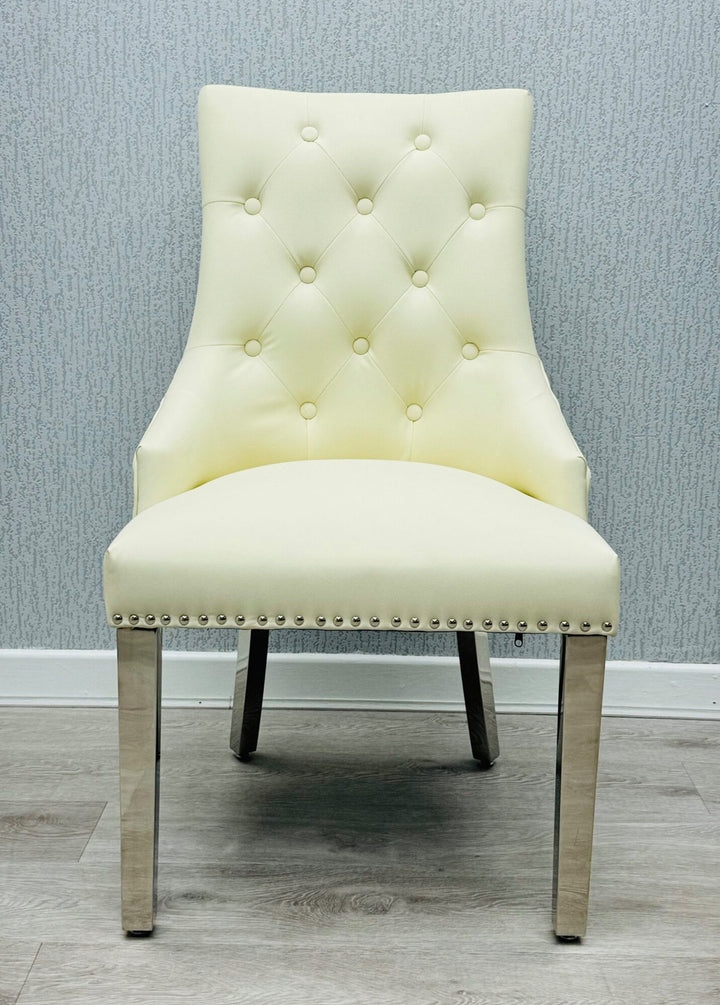  a cream color lion konker chair with chrome colour leg