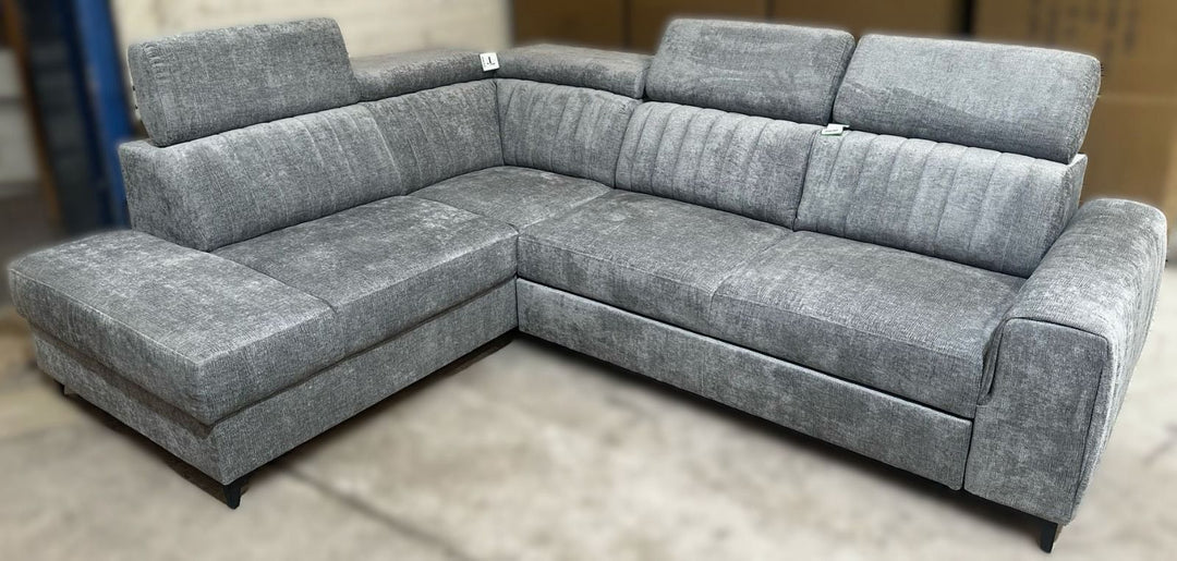 Gray sectional sofa on a neutral background