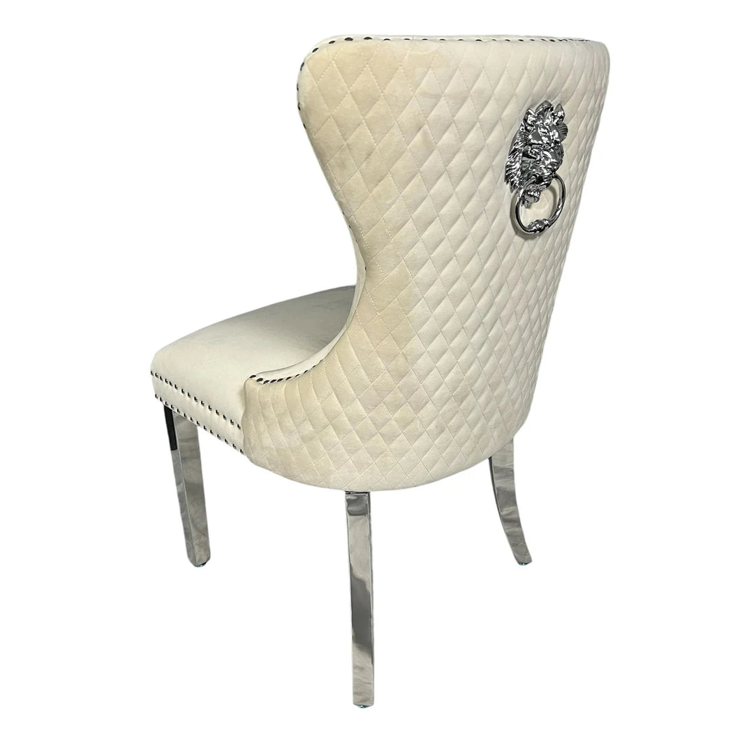 Decorative chair with quilted design and lion emblem on a white background