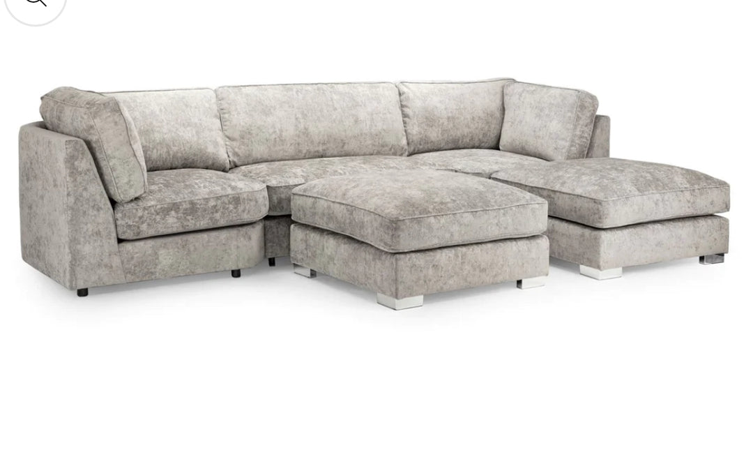 A gray u-shaped corner sofa with truffle-colored upholstery, featuring a solid wooden frame and moveable footstools.