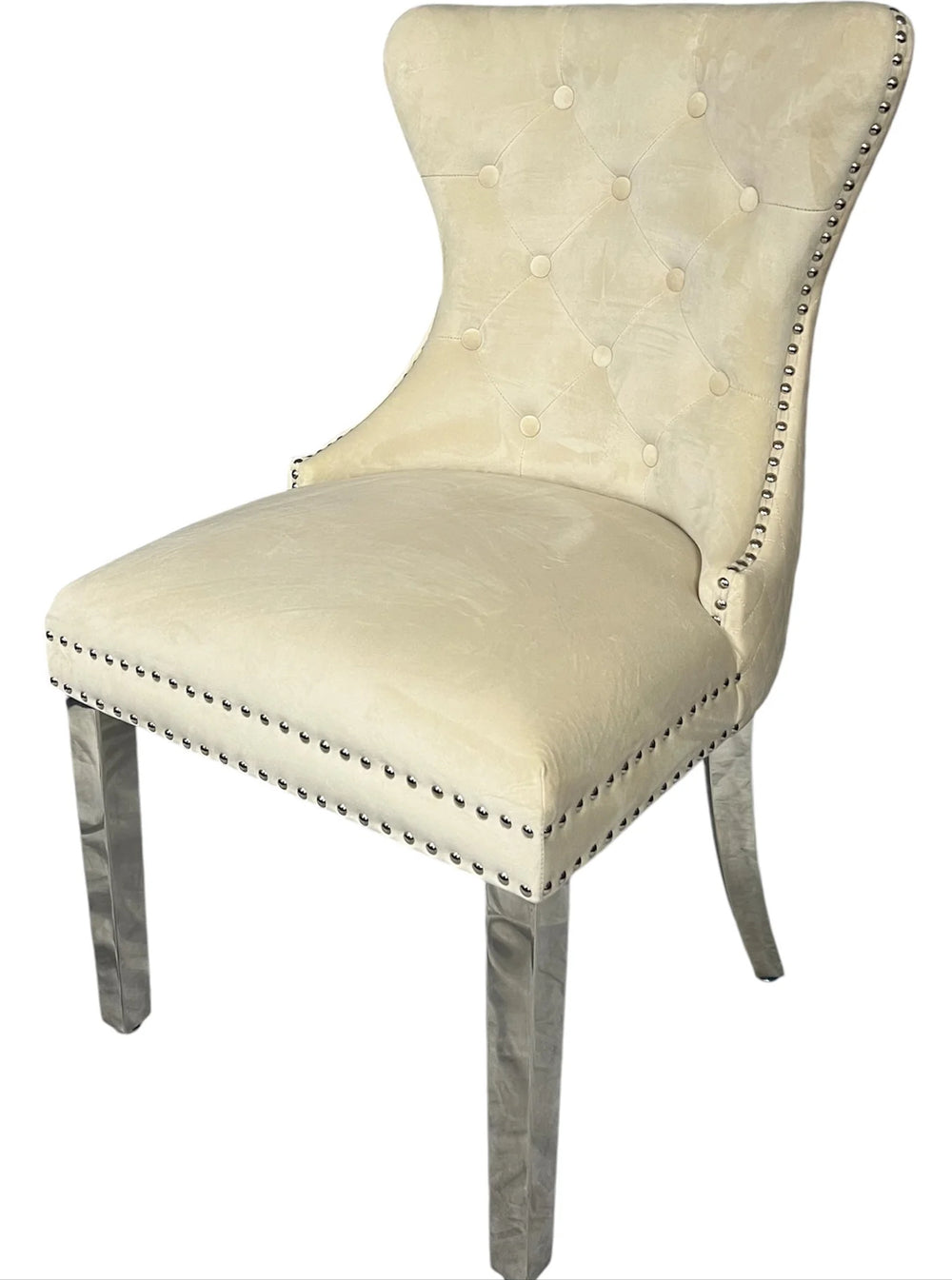 Beige upholstered chair with nailhead trim on a white background