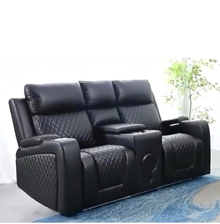 Black leather recliner sofa in a room with a rug and plant- 2 Seater Electric Recliner Sofa with Speaker 
