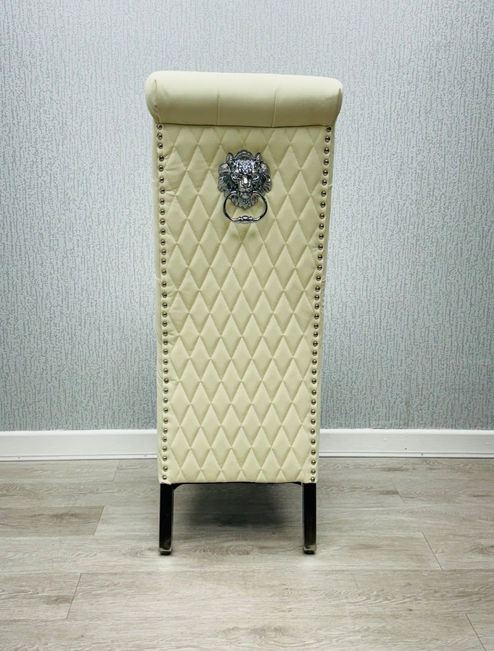 A single cream-colored dining chair with a high tufted backrest and upholstered back, seat, and legs made of wood.