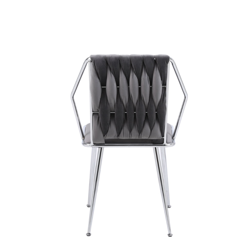 A grey fabric dining chair with a metal frame and armrests.