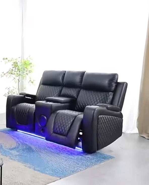 Black leather recliner with LED lighting in a room with plants and curtains.