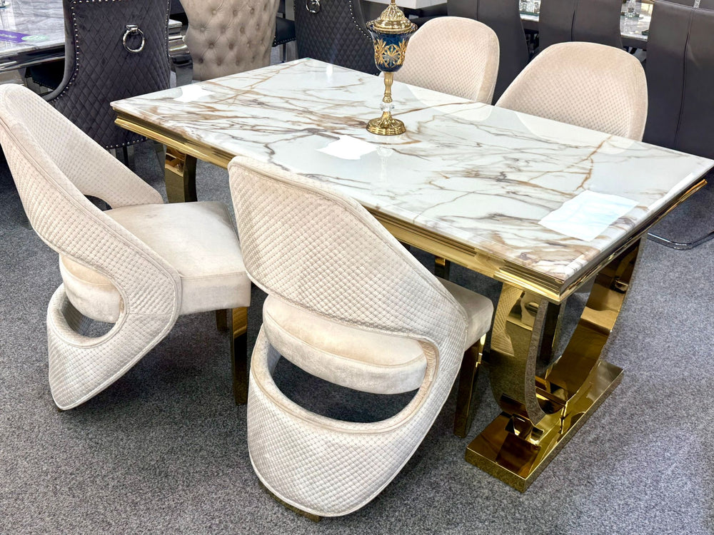 Arianna gold table with cream and gold dining chair 
Dining table with marble-like surface and gold accents, 