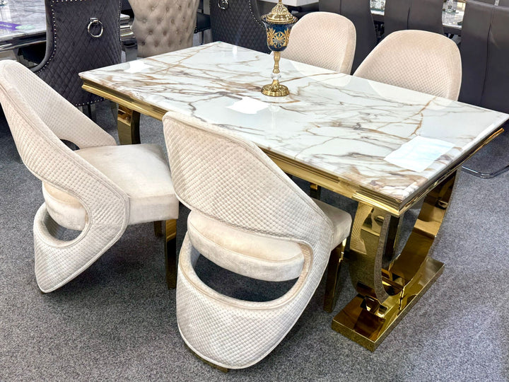 Arianna gold table with cream and gold dining chair 
Dining table with marble-like surface and gold accents, 