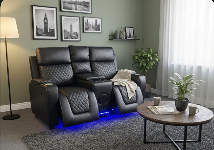 Modern living room with black leather recliner, wooden coffee table, and decorative elements.
