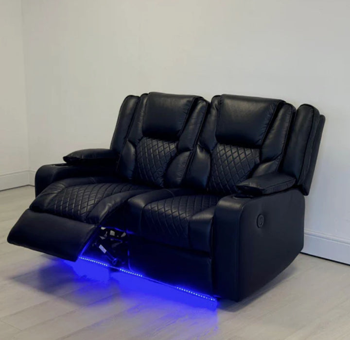 A black electric leather recliner sofa with a cup holder and illuminated by blue LED lights, set against a white background.