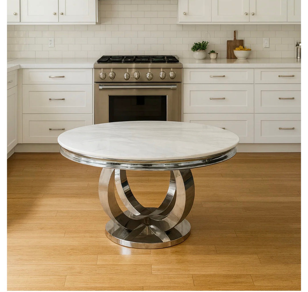 Round marble table with metal base in a kitchen setting
A round table in neutral tones, featuring a blend of grey, white, black, cream, and beige finishes.
