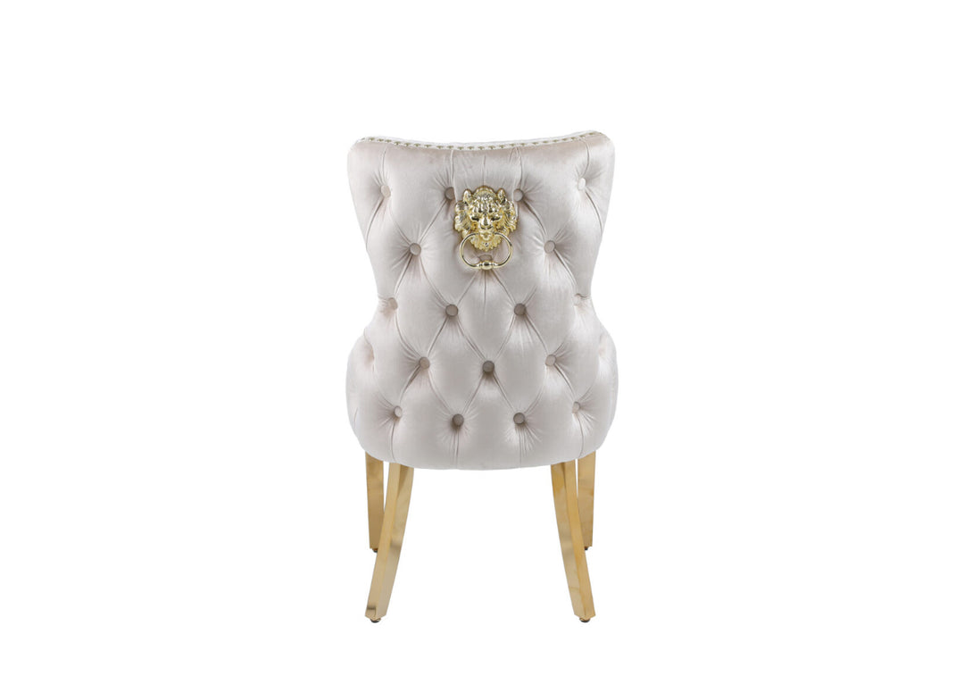 “Back view of cream dining chair with chrome lion head knocker”